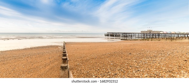 Shore With Pier In Hastings, East Sussex, UK.