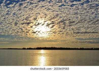 Shore Of The Paraná River, In Its Sunsets And Sunrises.