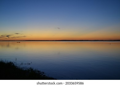 Shore Of The Paraná River, In Its Sunsets And Sunrises.