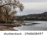 Shore of the St. Croix River at Lions Park in St. Croix Falls, Wisconsin USA.  Water is low due to work on the dam just south of here.