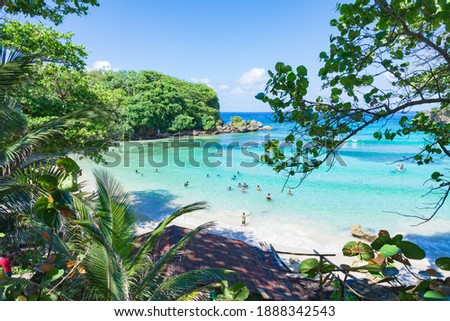Shore of Winnifred Beach, Jamaica. Turquoise waters, little wave