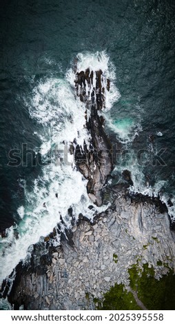 Similar – Aerial Drone View Of Dramatic Ocean Waves Crushing On Rocky Landscape