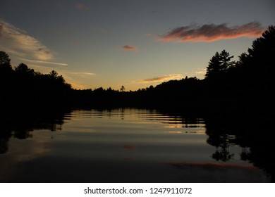 Shoreline Silhouette With Ripples In Water