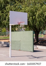 Short Basketball Hoop At Public Grade School Playground At Recess Area