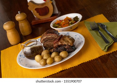 Short Beef Ribs, Roasted With Wine And Rosemary, Served With Boiled Potatoes And Vegetables