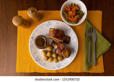 Short Beef Ribs, Roasted With Wine And Rosemary, Served With Boiled Potatoes And Vegetables