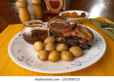 Short Beef Ribs, Roasted With Wine And Rosemary, Served With Boiled Potatoes And Vegetables