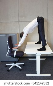 short break for yoga in the office - caucasian male professional exercising