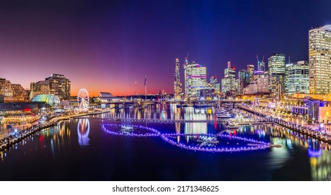 Short Bright sunset panorama of Darling harbour Cockle bay in Sydney city CBD at Vivid Sydney light festival show. - Shutterstock ID 2171348625