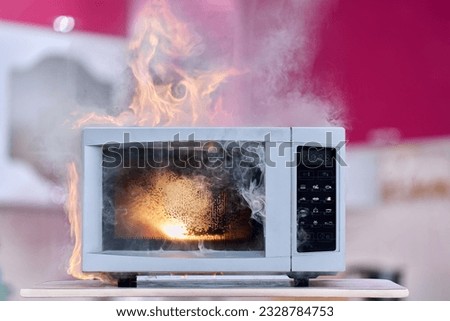 Short circuit in wiring of microwave oven led to fire and smoke in room.