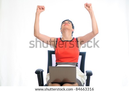 Short hair business woman on a laptop sitting in an office chair