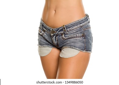Short mini jeans with long pockets on white background