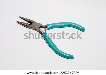 Short nose jewelry tools plier for stainless steel isolated in white background. Pliers body has green tosca color.