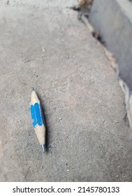 The Short Pencil Sharpened On Both Sides Fell On A Dusty And Dirty Classroom Floor