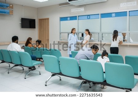 Short of the pharmacy provides services to patients in hospital ward. Group of sick people sitting on chairs, feeling happy and relax while waiting on line que to receive medicine in medical centers.