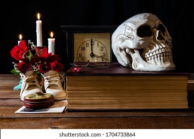 Short Time Between Birth And Death With Human Skull And Baby Shoes