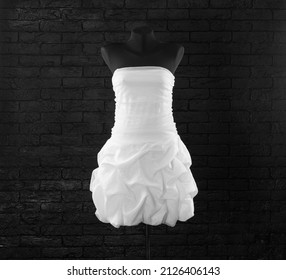 short white wedding dress on a mannequin