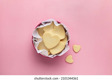 Shortbread cookies in shape of heart in red box on pink background. Mother's day, Women's day, Valentine's day. Homemade present. Copy space, top view. - Powered by Shutterstock