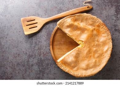 Shortbread pie with cheese and onions close-up in a plate on the table. Horizontal top view from above - Shutterstock ID 2141217889