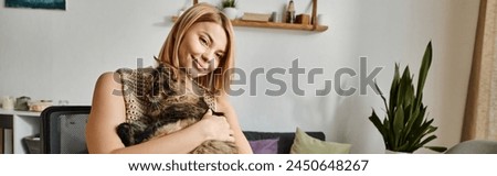 Similar – Image, Stock Photo Short-haired woman warms her hands with her breath in the autumn in the park