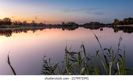 Shortly After Sunset At Giftener See. Red Buoy As Foreground Subject.