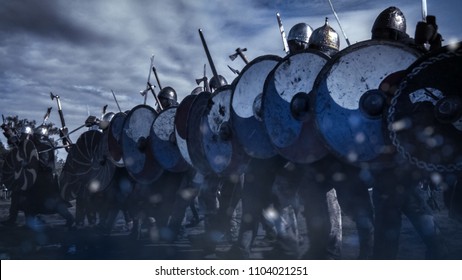 Shot Of Advancing Army Of Viking Warriors. Medieval Reenactment.