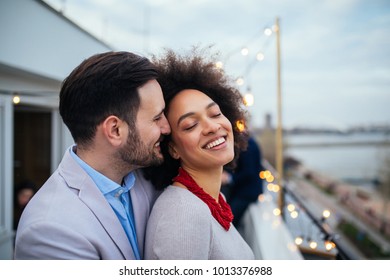 Shot of a affectionate couple standing outside - Shutterstock ID 1013376988