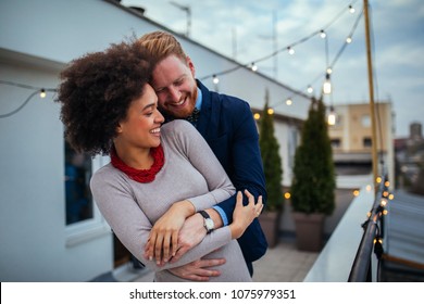 Shot of a affectionate couple standing outside - Shutterstock ID 1075979351