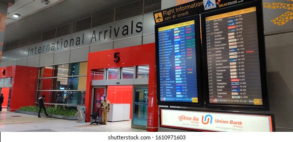 Shot Of Arrivals Gate At Indira Gandhi International Airport, Terminal 3. With Display Board Showing Flight Arrival And Departure Information To People Who've Come To Recieve Family
Delhi, India 2020