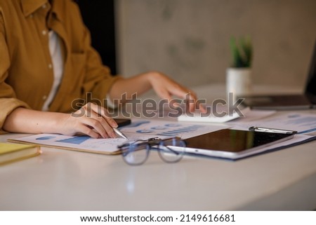 	
Shot of an Asian young businesswoman working on a laptop computer in her workstation, startup Business people employee freelance online marketing e-commerce telemarketing concept.