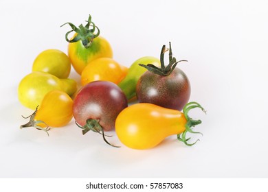 Shot Of Assorted Baby Heirloom Tomatoes On White