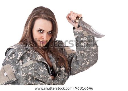 Shot of attractive girl in military uniform holding a knife