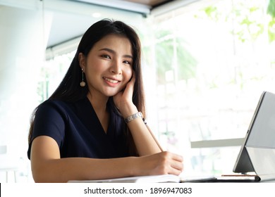Shot of an attractive mature businesswoman working on laptop in her workstation. 