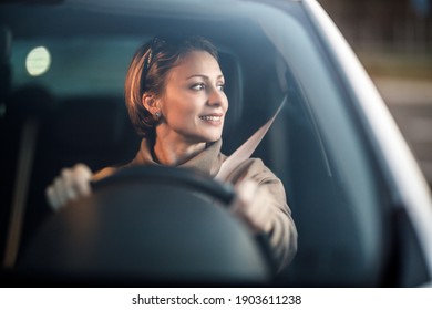 Shot Of An Attractive Mature Woman Driving Her Car.