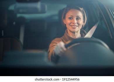 Shot Of An Attractive Mature Woman Driving Her Car.