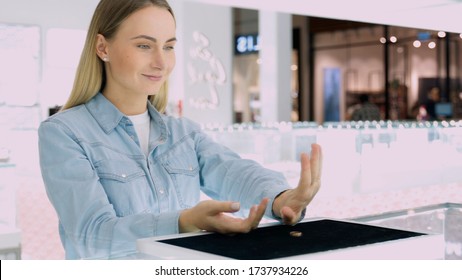 Shot Of Attractive Young Woman Out Shopping For Jewelry. Girl Lookin At He Hand Trying To Choose Rings.