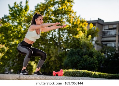 Shot of an attractive young woman working out outside