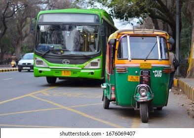 Shot of an auto rickshaw on Delhi roads with a DTC bus behind it. Autos and buses are economical public transport in Delhi for last mile travel. Uber and Ola are also running autos
Delhi, India : 2020