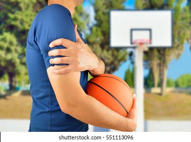 Shot Of A Basketball Player With A Shoulder Injury At Oudoors