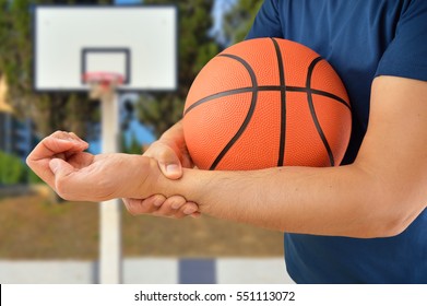 Shot Of A Basketball Player With A Wrist Injury At Oudoors