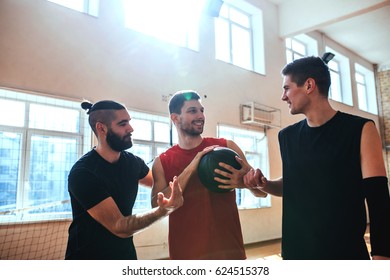 Shot Of Basketball Teammates Having Fun Indoors