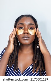 Shot Of A Beautiful African Woman Wearing Under-eye Gel Patches As Part Of Her Beauty Regime