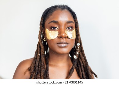 Shot Of A Beautiful African Woman Wearing Under-eye Gel Patches As Part Of Her Beauty Regime