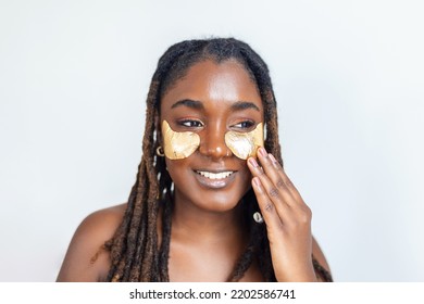 Shot Of A Beautiful African Woman Wearing Under-eye Gel Patches As Part Of Her Beauty Regime