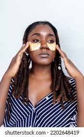 Shot Of A Beautiful African Woman Wearing Under-eye Gel Patches As Part Of Her Beauty Regime