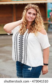 Shot of a beautiful, blond, plus-size model in summer clothes