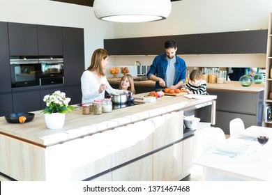 Shot of beautiful cute family having fun while cooking together in the kitchen at home.