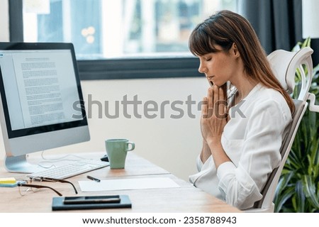 Shot of beautiful smart nutritionist woman doing meditation while working with computer in a nutritionist consultation 