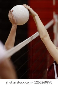 A Shot Is Blocked In A Girls High School Volleyball Game