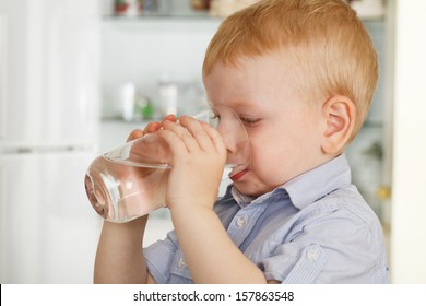 Shot Of A Boy Drinking A Glass Of Water